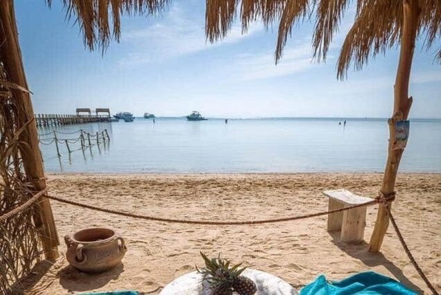 White sandy beach and shallow waters of Orange Bay island in Hurghada