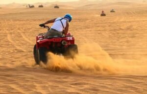 Action shot of spider car buggies racing across the Hurghada desert sand dunes Mini Super Safari | Best Hurghada Quad & Camel Tour 2026