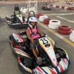 A line of modern racing go-karts competing closely for the best lap time challenge go kart el gouna price