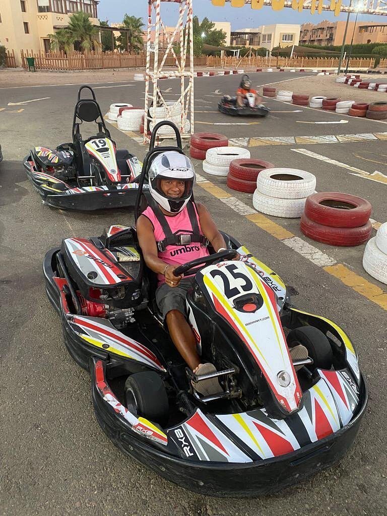 A line of modern racing go-karts competing closely for the best lap time challenge go kart el gouna price