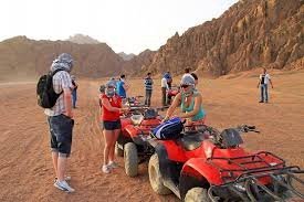 Tourists enjoying a 30-minute quad bike ride during the Aladin Safari Trip