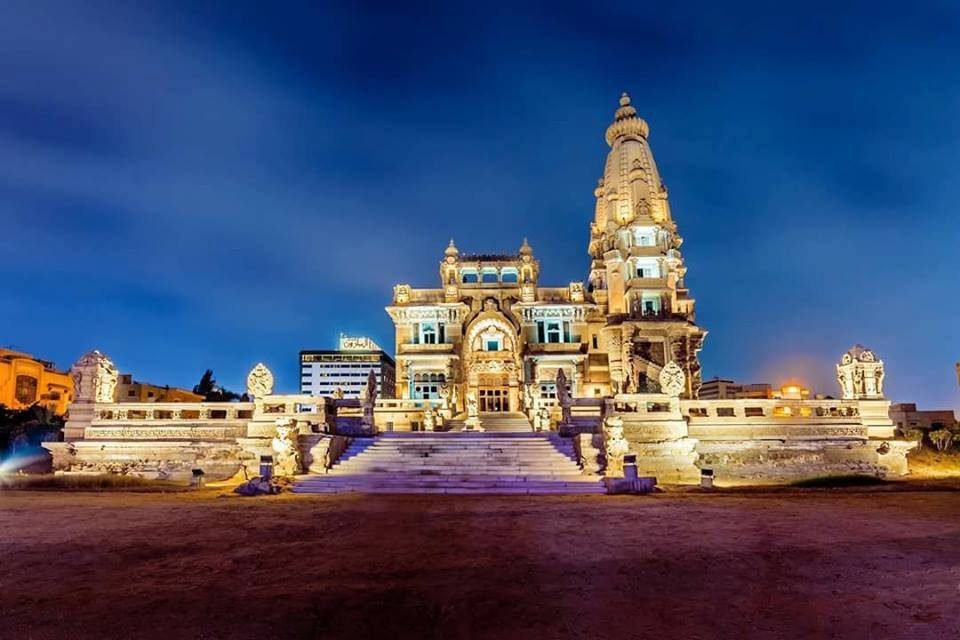 The majestic Baron Empain Palace in Heliopolis Cairo showing its unique Hindu-Khmer architectural design under a clear sky Cairo Bus Tours